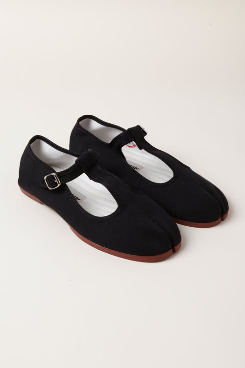 TRB#001, black tabi T-bar Mary Jane flats, three-quarter pair view on a pale background.