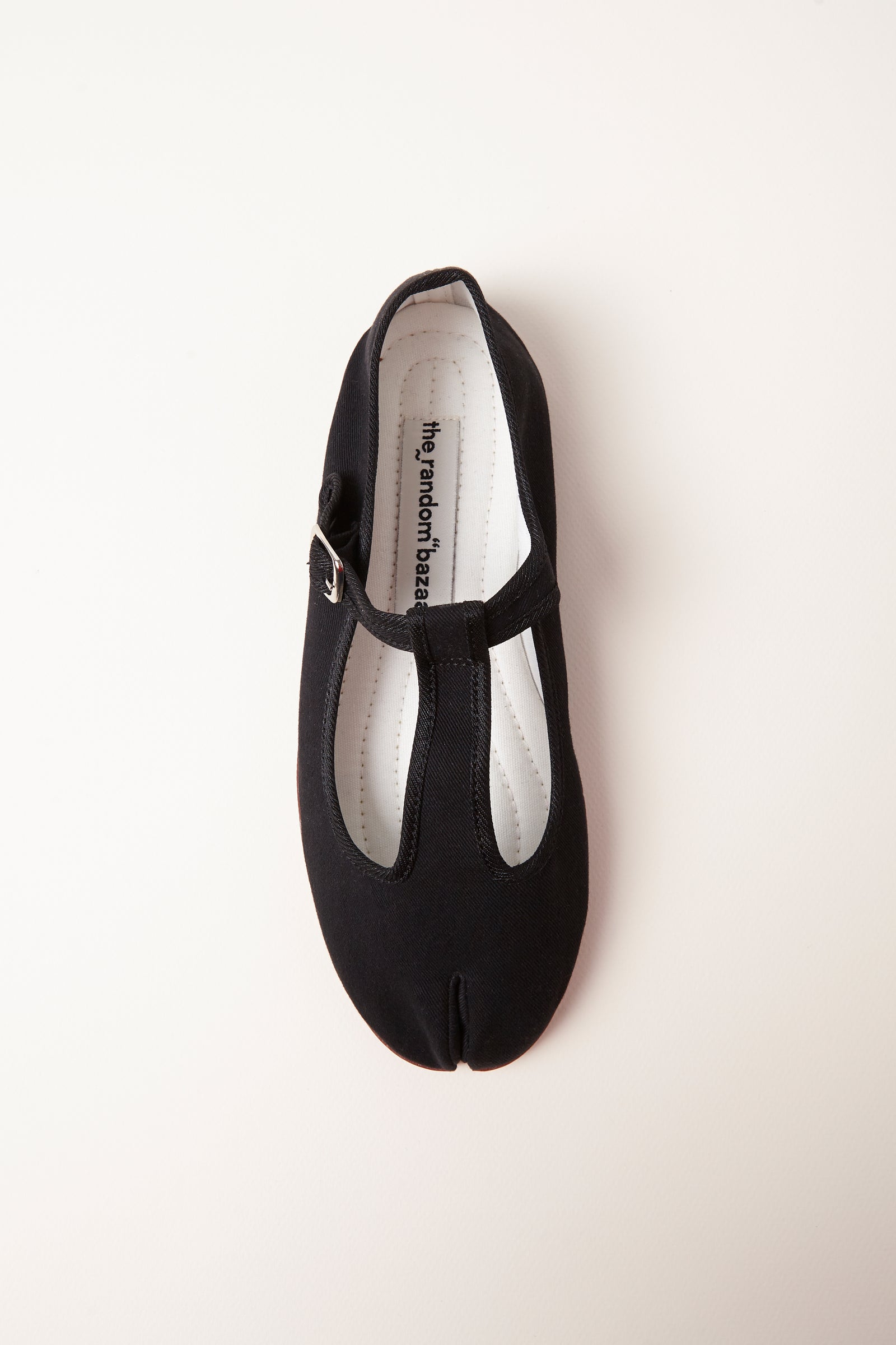 TRB#001 from above, detail of the T-bar strap, silver buckle and branded insole.