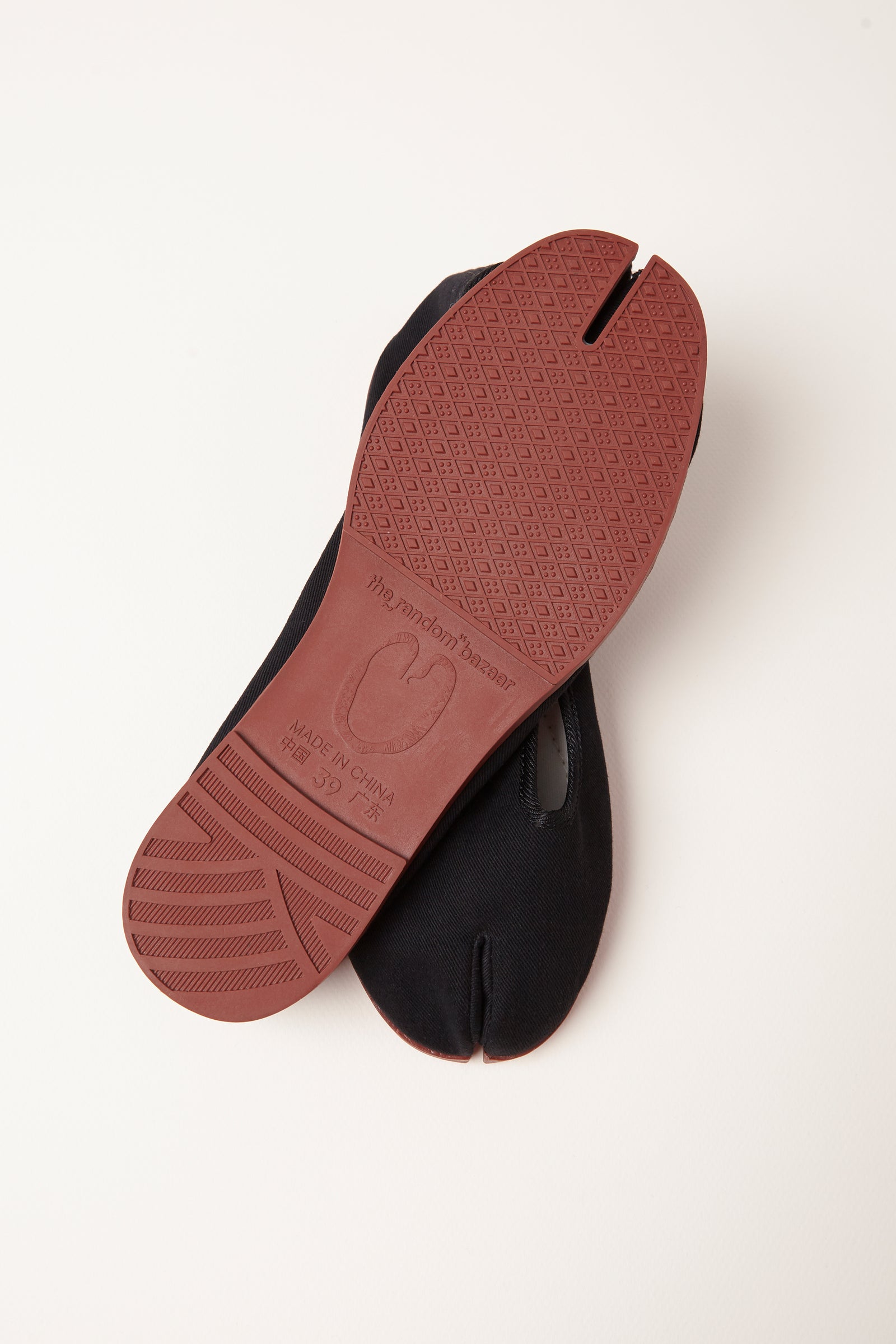 TRB#001 underside, terracotta patterned sole with the mascot stamp and size mark.